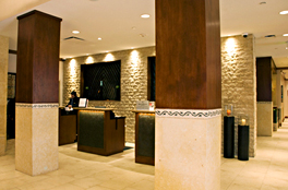 Custom built hotel reception stations and custom millwork for molding, window frames, and column paneling.