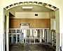 Before: Countertop and Sink Cabinets were removed, mold treated and eliminated, and then rebuilt and finished to match kitchen cabinetry which was stripped, sanded, stained, refaced, and refinished. 